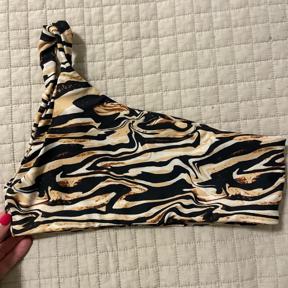 Skatie one shoulder bikini top. Never worn. NWOT. Top only!